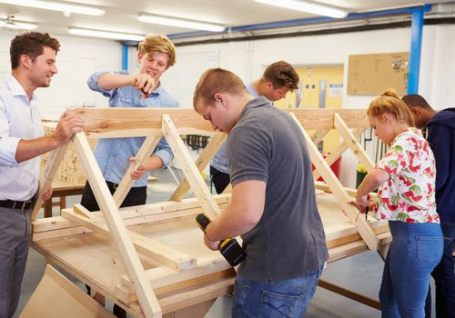 High School students building a wooden roof