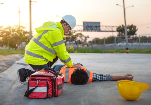 Accident at work of construction labor people, Basic First aid and CPR Training at outdoor. Heat Stroke or Heat exhaustion in body concept.
